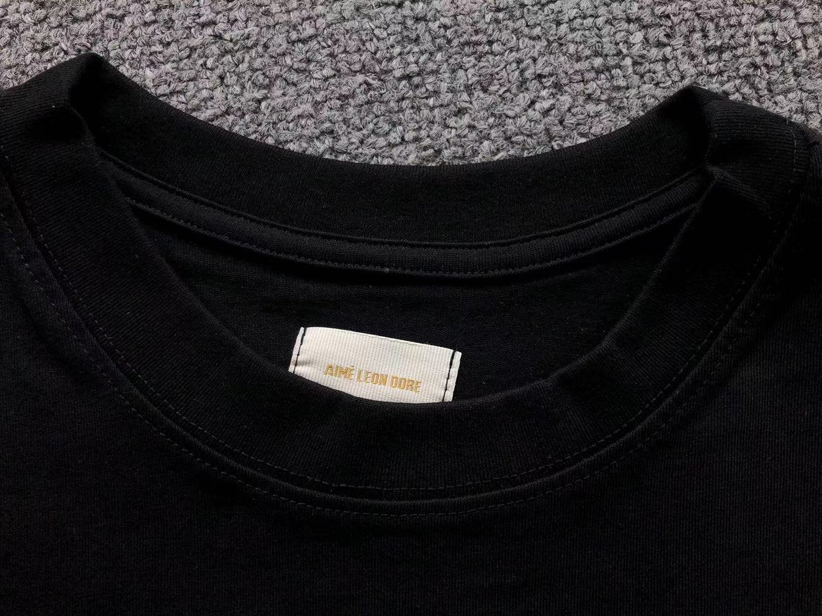 Camiseta Aimé Leon Dore A Family Business