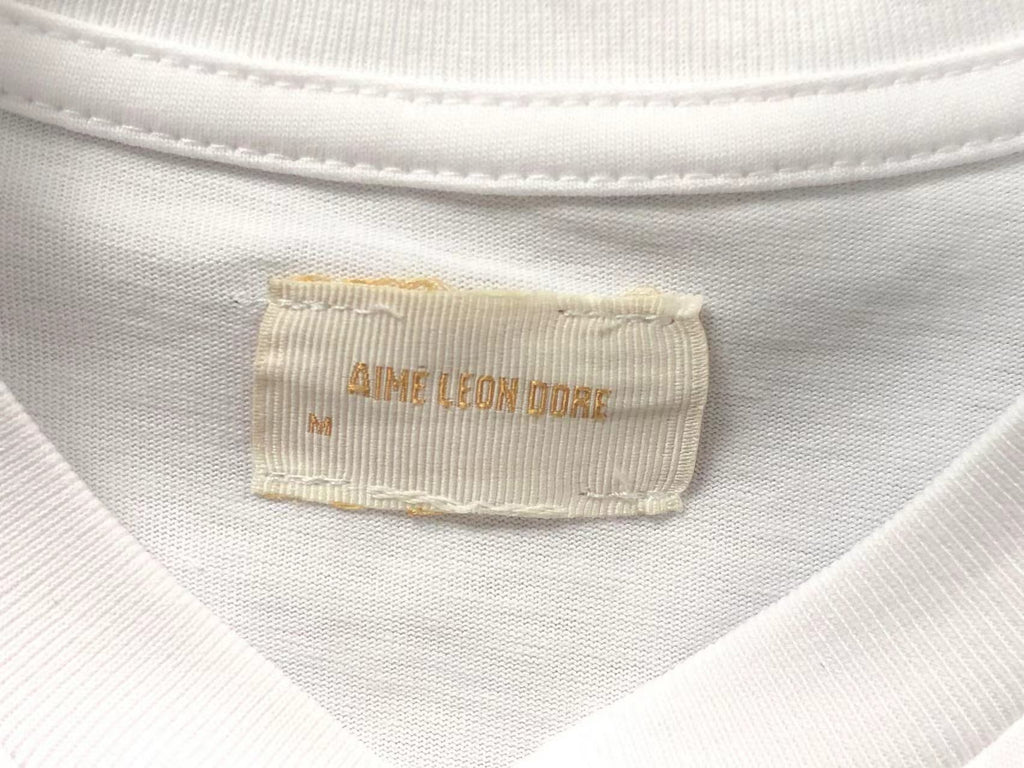 Camiseta Aimé Leon Dore x Tyrrell Winston Championship Tee