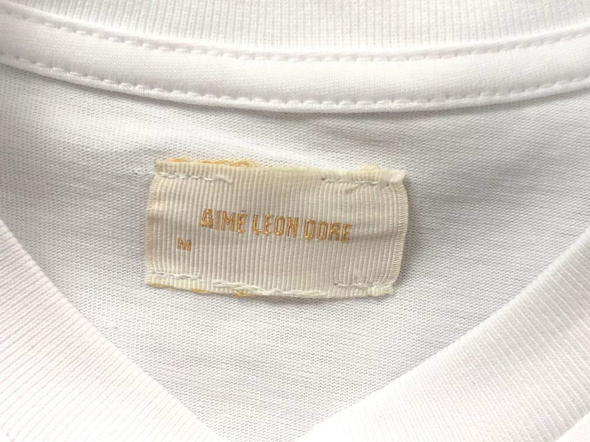 Camiseta Aimé Leon Dore x Tyrrell Winston Championship Tee