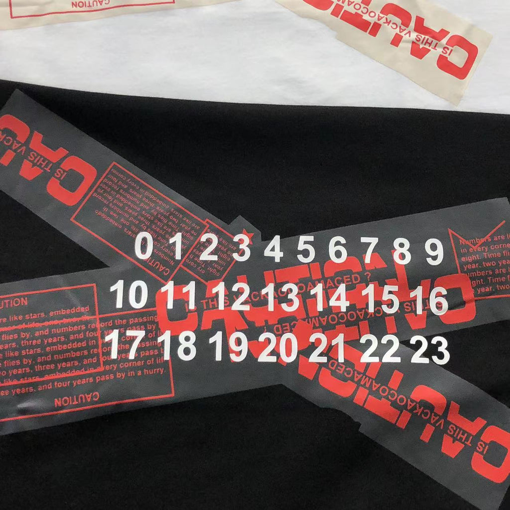 Camiseta Maison Margiela Caution